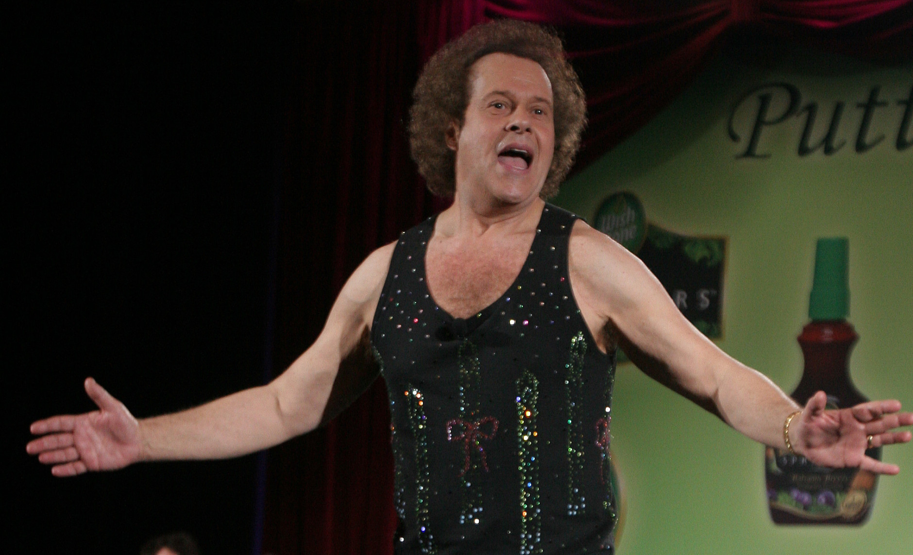 FILE - In this June 2, 2006, file photo, Richard Simmons speaks to the audience before the start of a summer salad fashion show at Grand Central Terminal in New York. Simmons told USA Today on June 5, 2016, that he was "feeling great" after being hospitalized for dehydration. (AP Photo/Tina Fineberg, File)