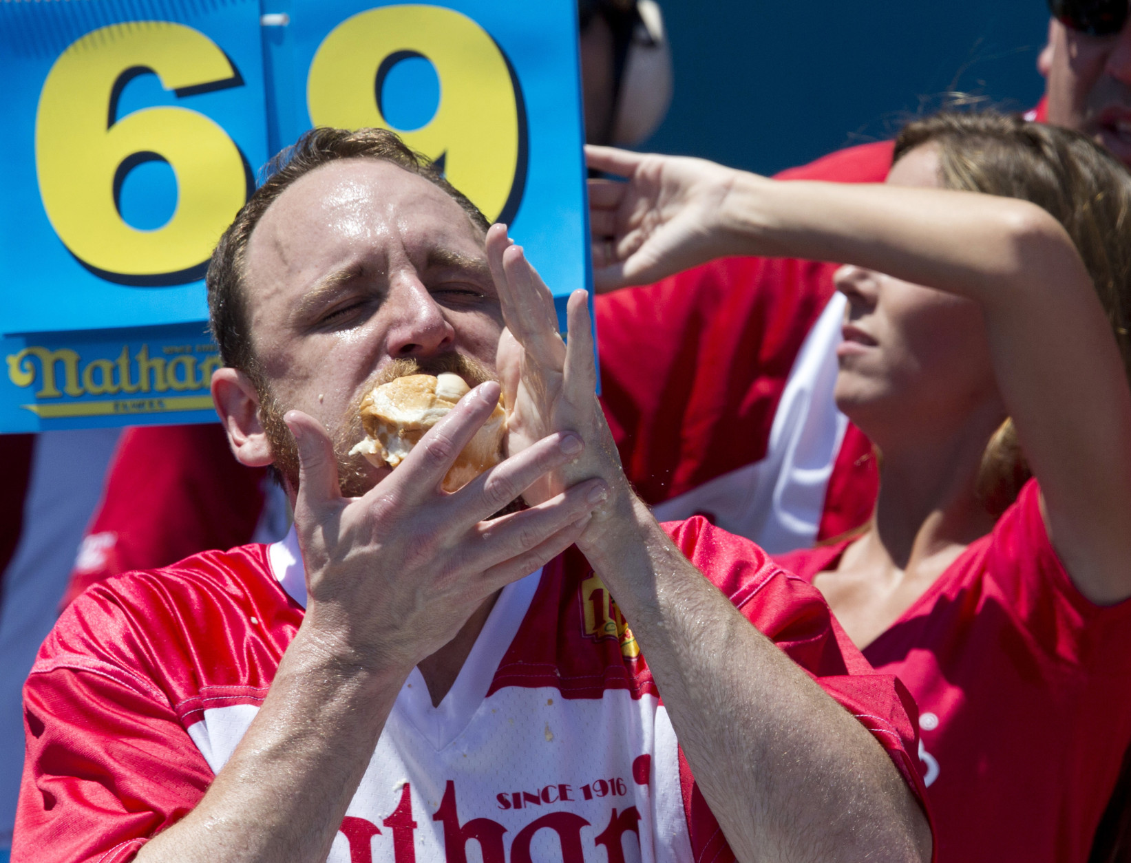 Joey Chestnut competes in Nathan's Famous Fourth of July International Hot Dog Eating Contest men's competition, Monday, July 4, 2016, in New York. Chestnut came in first eating 70 hot dogs and buns in 10 minutes. (AP Photo/Mary Altaffer)