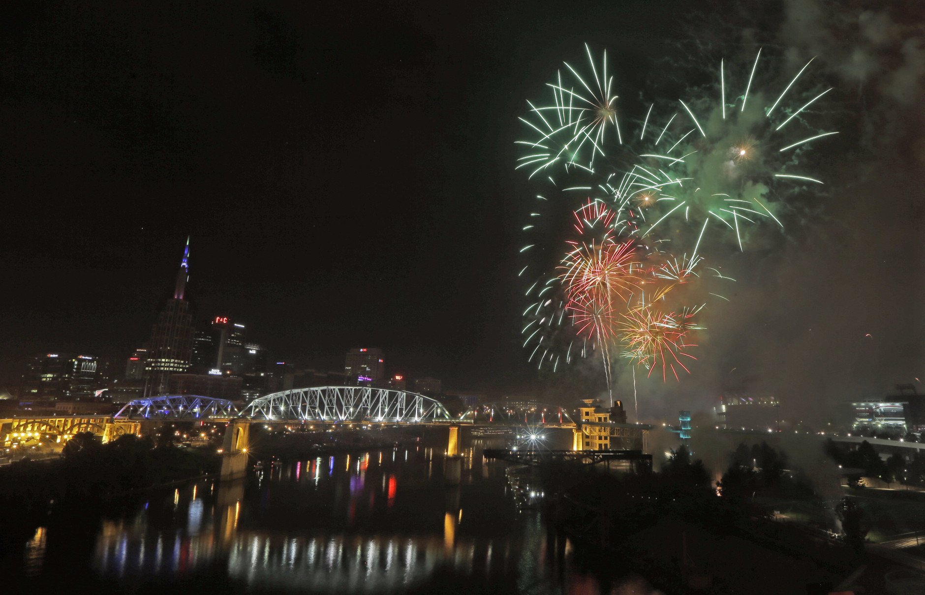 Fourth of July fireworks explode over the Cumberland River Monday, July 4, 2016, in Nashville, Tenn. The Independence Day fireworks display is the largest in the country. (AP Photo/Mark Humphrey)