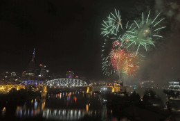 Fourth of July fireworks explode over the Cumberland River Monday, July 4, 2016, in Nashville, Tenn. The Independence Day fireworks display is the largest in the country. (AP Photo/Mark Humphrey)