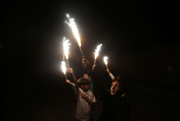 Yemeni boys play with sparklers as they celebrate for the upcoming Eid al-Fitr festival, in Sanaa, Yemen, Tuesday, July 5, 2016. (AP Photo/Hani Mohammed)