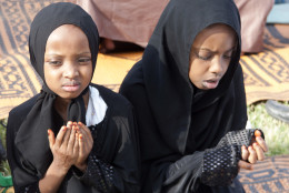 Muslim girls attend the Eid al-Fitr prayers as Muslims around the world celebrate the end of the holy month of Ramadan in Nairobi, Kenya, Wednesday, July 6, 2016. (AP Photo/ Sayyid Abdul Azim)
