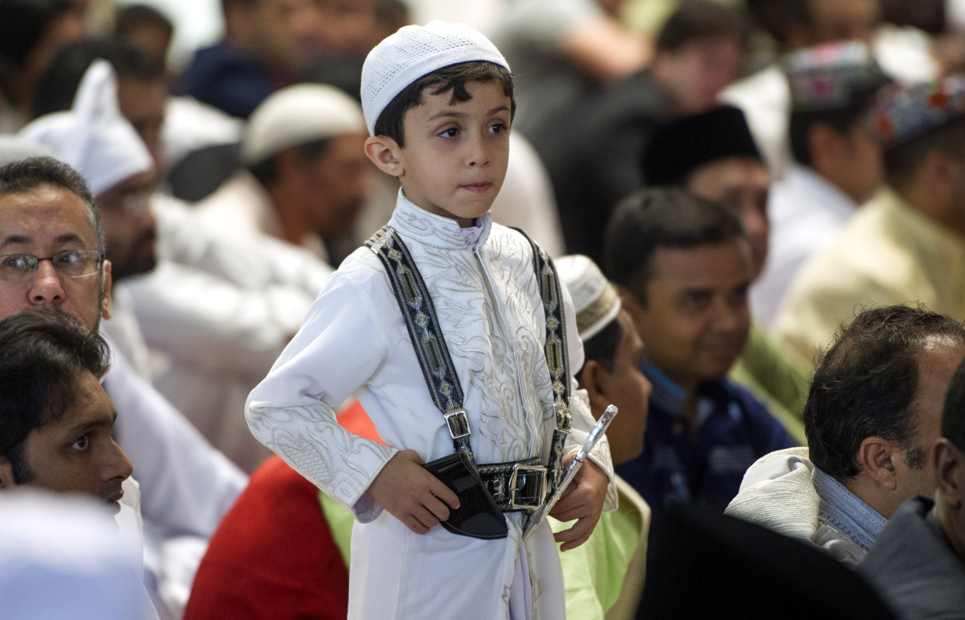 A boy stands up after Eid al-Fitr prayers marking the end of the holy fasting month of Ramadan in Mexico City, Wednesday, July 6, 2016. According to the Washington-based Pew Forum on Religion and Public Life, today there are approximately 110,000 Muslims living in Mexico. (AP Photo/Nick Wagner)