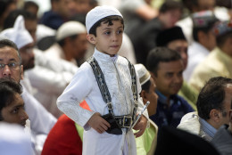 A boy stands up after Eid al-Fitr prayers marking the end of the holy fasting month of Ramadan in Mexico City, Wednesday, July 6, 2016. According to the Washington-based Pew Forum on Religion and Public Life, today there are approximately 110,000 Muslims living in Mexico. (AP Photo/Nick Wagner)