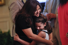 Rachael Ray, hugs Gianna Malecki, 8, from New Jersey, at the 2016 Kids' State Dinner in the East Room of the White House in Washington, Thursday, July 14, 2016. The event is hosted by first lady Michelle Obama and is part the Healthy Lunchtime Challenge inviting 8 to 12-years-olds across the country to create healthy, affordable, original, and delicious lunch recipes. (AP Photo/Pablo Martinez Monsivais)