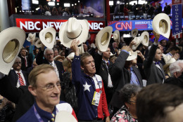 Texas delegates hold up their hats during the final day of the Republican National Convention in Cleveland, Thursday, July 21, 2016. (AP Photo/John Locher)