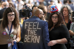 Florida Delegate Sanjay Patel wears a jacket in support of former Democratic presidential candidate Bernie Sanders, I-VT, during the first day of the Democratic National Convention in Philadelphia , Monday, July 25, 2016. (AP Photo/Paul Sancya)