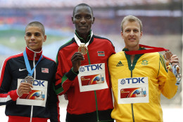 Gold medal winner Asbel Kiprop of Kenya is flanked by silver medal winner Matthew Centrowitz of United States, left, and bronze medal winner Johan Cronje of South Africa during the ceremony for the men's 1500-meter at the World Athletics Championships in the Luzhniki stadium in Moscow, Russia, Sunday, Aug. 18, 2013. (AP Photo/Alexander Zemlianichenko)