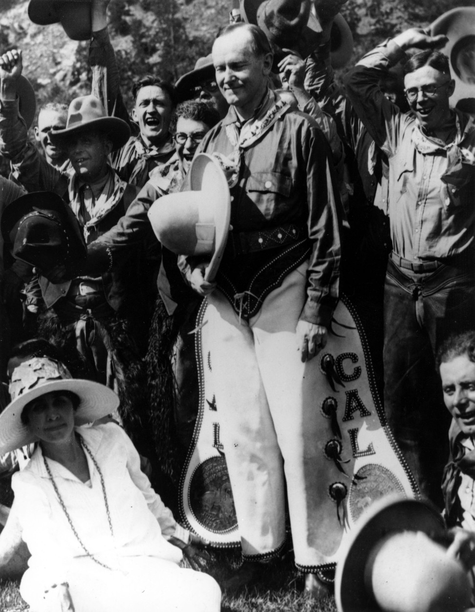 U.S. President Calvin Coolidge, clad in cowboy attire celebrates the Fourth of July Holiday with his wife Grace Goodhue Coolidge in Rapid City North Dakota on July 4, 1927.  Others are unidentified.  (AP Photo)