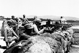 Members of the Chinese 29th Army defend the city behind a hastily constructed sandbag barricade on the Marco Polo Bridge, 14 miles southwest of Pieping, China, against Japanese attackers on July 8, 1937.  On July 7, Chinese troops fired on Japanese troops at the Marco Polo bridge, a clash between the two countries that led to the Second Sino Japanese War.  (AP Photo)
