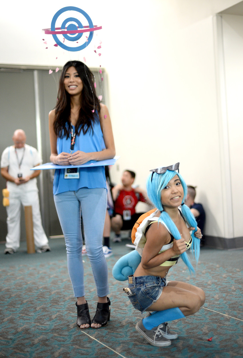 Melanie Cabalu, left, as a "Pokemon Go" PokeStop,  and Asta Young as a Squirtle on day 3 of Comic-Con International on Saturday, July 23, 2016, in San Diego. (Photo by Al Powers/Invision/AP)