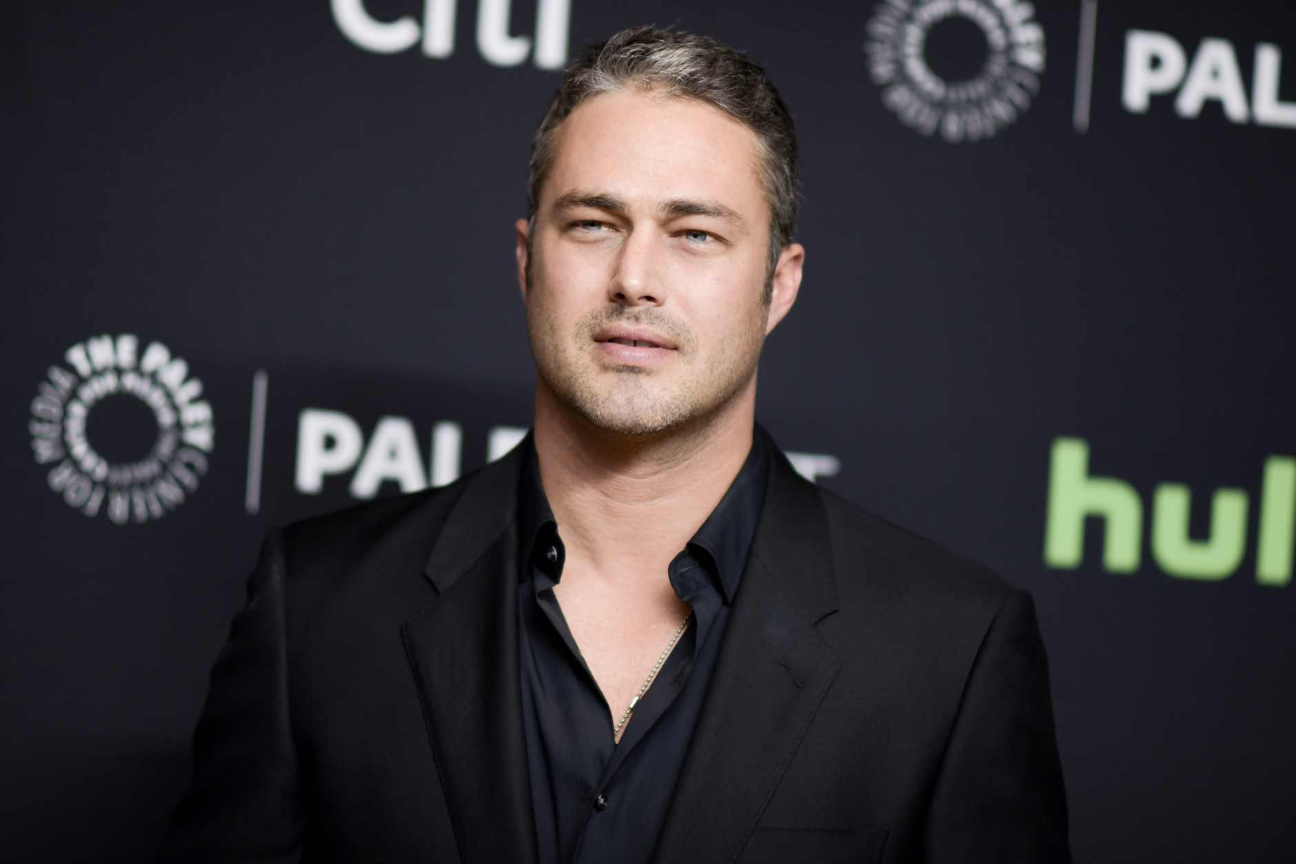 Taylor Kinney attends the 33rd Annual Paleyfest: "An Evening With Dick Wolf" held at the Dolby Theatre on Saturday, March 19, 2016, in Los Angeles. (Photo by Richard Shotwell/Invision/AP)