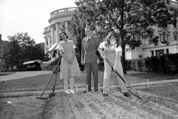 When Harry Hopkins and his wife, who live at the White House with his daughter, Diana, strolled out on the White House lawn in Washington on May 10, 1943, they found Diana, garbed in overalls, busily hoeing in her victory garden. Mrs. Hopkins had just returned from duty as a volunteer nurse and still was wearing her uniform. (AP Photo)