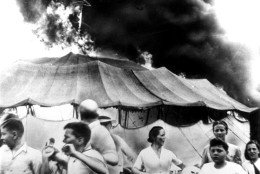 This was the scene of pandemonium at Hartford, Conn., on July 6, 1944, when a fire in which over 145 persons died, struck the tented Ringling Bros. Barnum and Bailey Circus.  On July 16, the circus folded its mammoth tent for the last time after a performance at Pittsburgh, Pa., and then appeared in 1957 in indoor arenas.  Labor troubles, bad weather, and rising costs sounded the death knell for the circus tour which thrilled millions of youngsters and grownups.  (AP Photo)