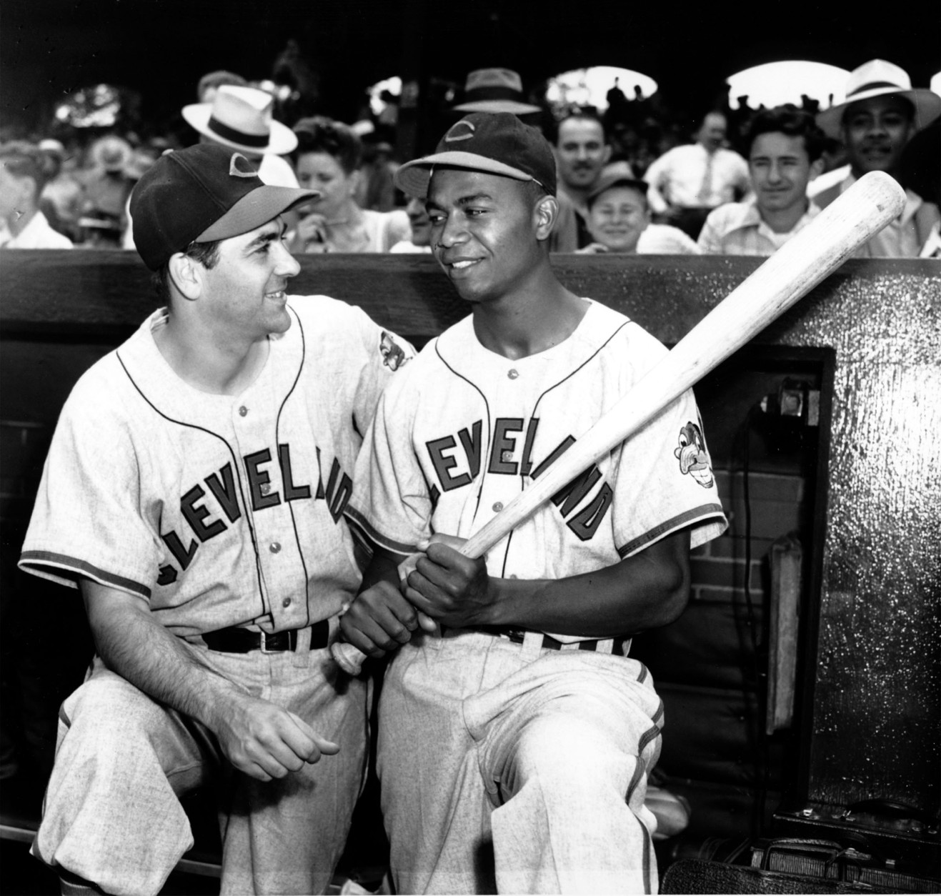 Manager Lou Boudreau and Larry Doby, first black player in the American League, stand in the dugout at Comiskey Park in Chicago, Ill., on July 5, 1947.  (AP Photo)