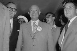 Republican presidential candidate Dwight D. Eisenhower, beaming and happy, wears an "I Like Everybody," pin on his coat lapel before leaving his hotel for the convention hall in Chicago, July 11, 1952, where the Republican National Convention is being held.  Others are unidentified.  (AP Photo)