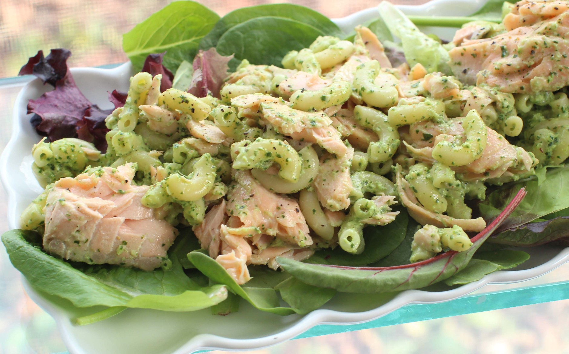 This Feb. 1, 2016 photo shows pasta salad with salmon and creamy cilantro dressing in Concord, N.H. This delicious spring dish is easy to assemble and travels well, making it perfect for packed lunches and picnics. It also can be prepped in advance by poaching the fish and cooking the pasta the night before. (AP Photos/Matthew Mead)
