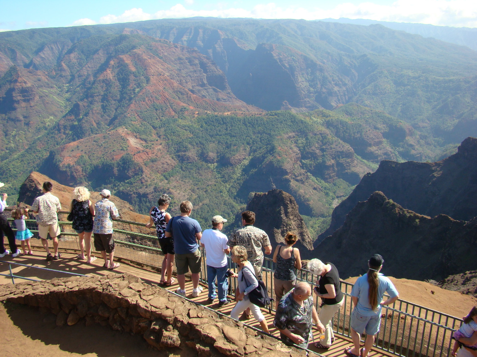 This Jan. 5, 2012 photo shows tourists lining up to view Waimea Canyon on the island of Kauai, Hawaii. The natural wonder has been dubbed the Grand Canyon of the Pacific. (AP Photo/Joe Kafka)