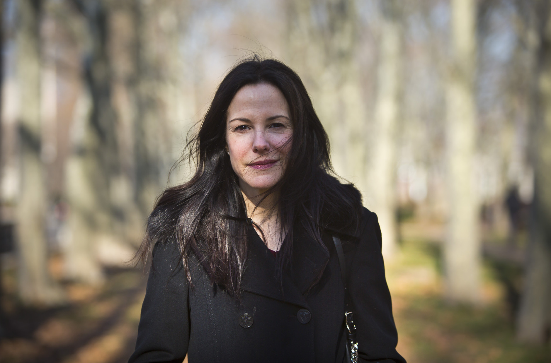 In this Dec. 7, 2015 photo, actress and author Mary-Louise Parker poses for portrait in a park in the Brooklyn borough of New York. Parker's "Dear Mr. You," a collection of lyrical and often emotional essays about men addressed to everyone from former (and unnamed) lovers to family members, has been highly praised by critics and made the actress a respected name in the literary world. (AP Photo/Bebeto Matthews)
