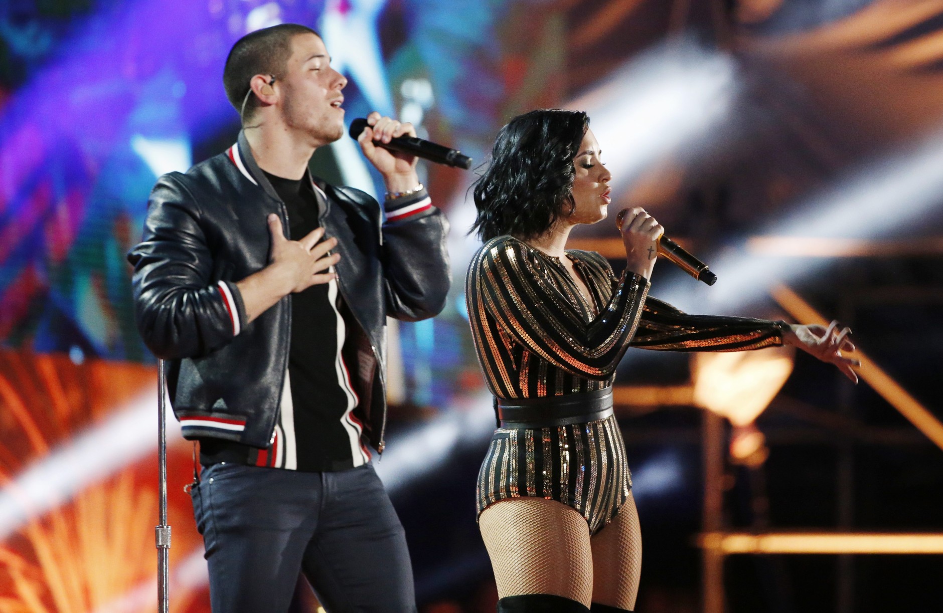 Nick Jonas and Demi Lovato perform during rehearsal for the annual Boston Pops Fireworks Spectacular on the Esplanade in Boston, Sunday, July 3, 2016. (AP Photo/Michael Dwyer)
