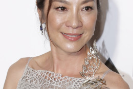 Malaysia actress Michelle Yeoh poses on the red carpet for the fundraising gala organized by amfAR (The Foundation for AIDS Research) in Hong Kong, Saturday, March 19, 2016. (AP Photo/Kin Cheung)