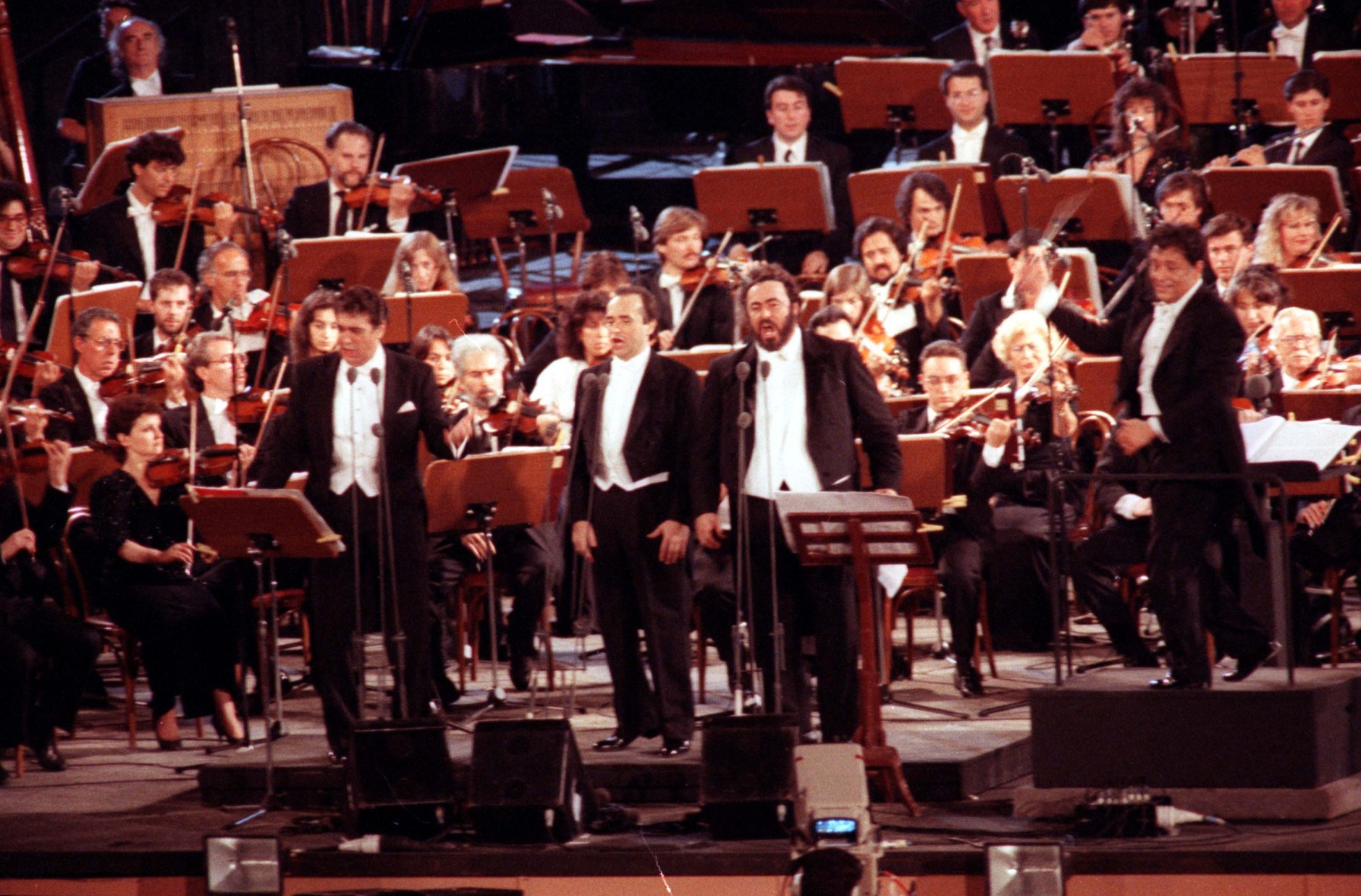 Luciano Pavarotti, Placido Domingo and Jose Carreras perform as the Three Tenors, at their first concert in the Roman Baths of Caracalla, Rome, Italy, July 7, 1990, during the 1990 World Cup. (AP Photo/Bruno Mosconi)