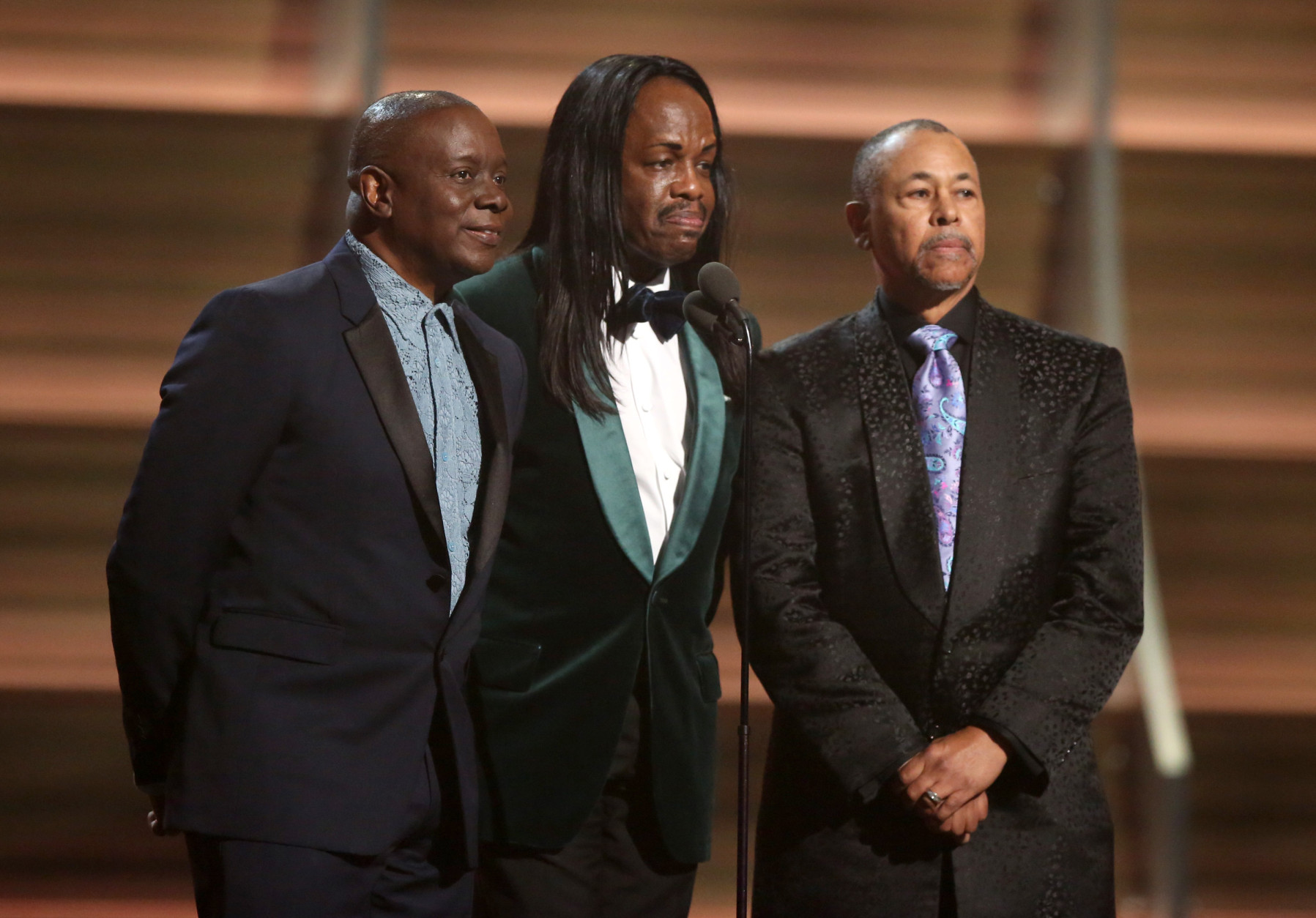 Philip Bailey, from left, Verdine White, and Ralph Johnson of Earth Wind &amp; Fire present the award for album of the year at the 58th annual Grammy Awards on Monday, Feb. 15, 2016, in Los Angeles. (Photo by Matt Sayles/Invision/AP)