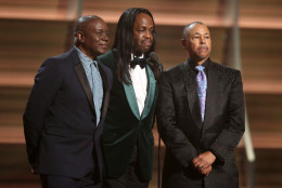 Philip Bailey, from left, Verdine White, and Ralph Johnson of Earth Wind &amp; Fire present the award for album of the year at the 58th annual Grammy Awards on Monday, Feb. 15, 2016, in Los Angeles. (Photo by Matt Sayles/Invision/AP)