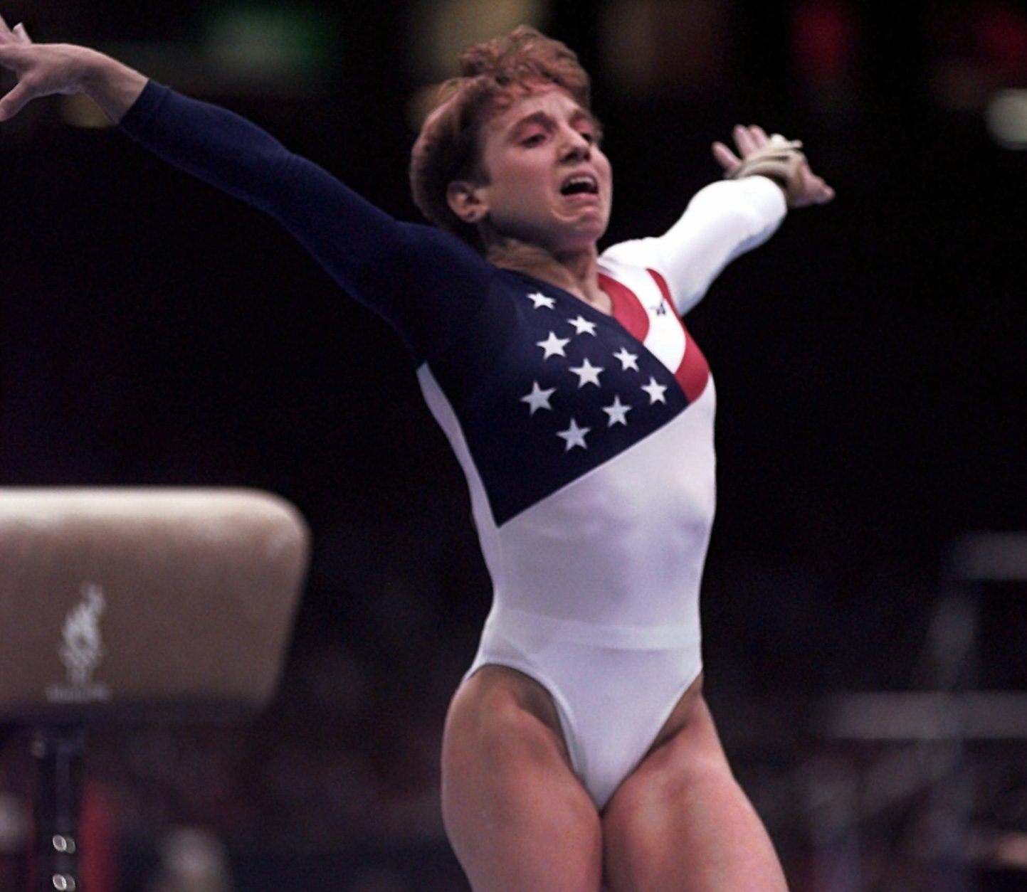 Kerri Strug, of Houston, Texas, reacts after badly landing on her left leg following her vault routine at the women's team gymnastics competition at the Centennial Summer Olympic Games in Atlanta on Tuesday, July 23, 1996.   (AP Photo/John Gaps III)