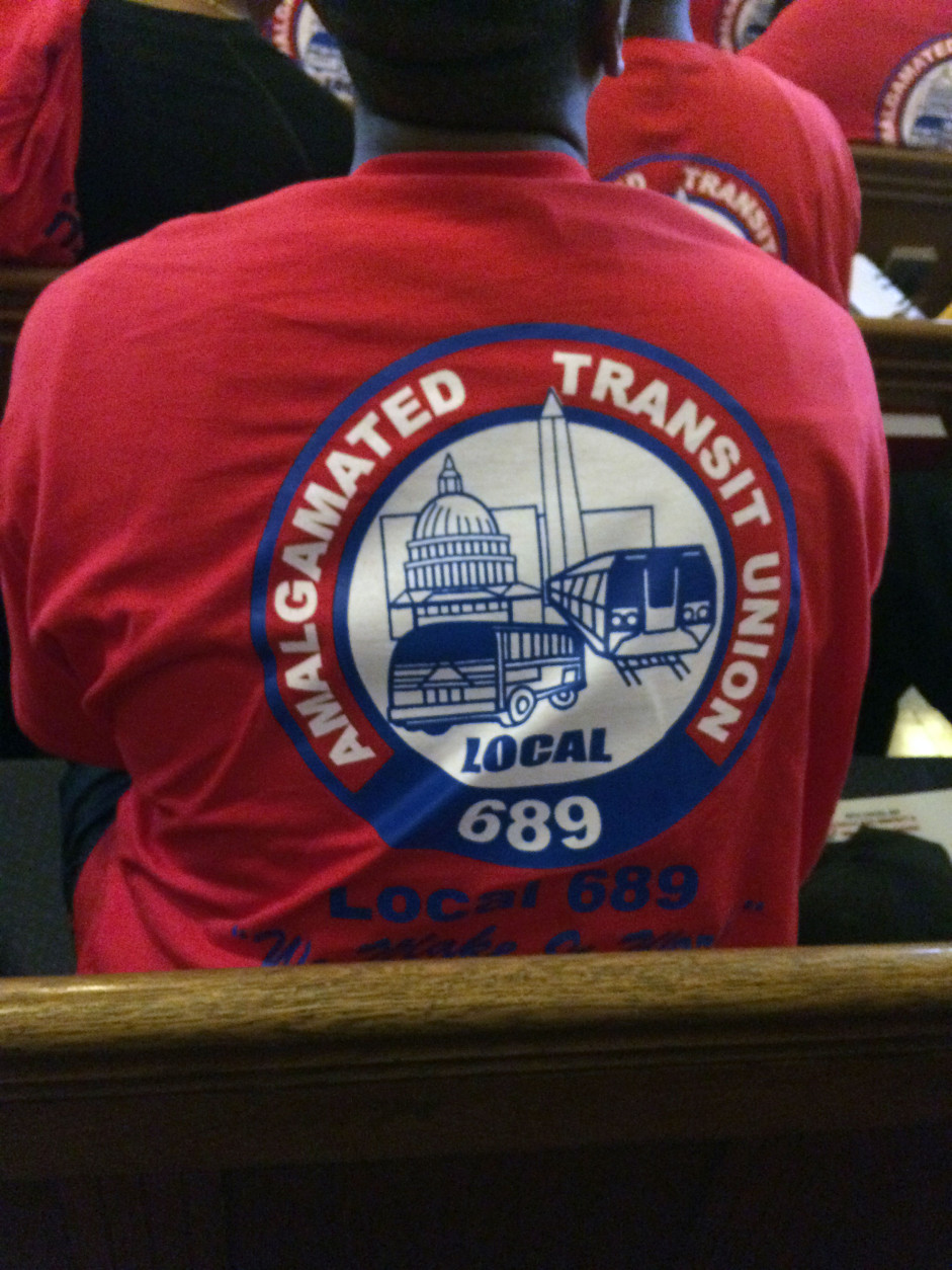 In a show of support, members of the Amalgamated Transit Union local 689 wore these T-shirts during a rally Saturday, July 30, 2016. (WTOP/Dick Uliano)