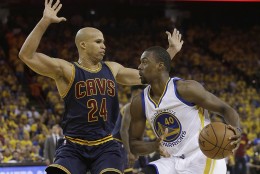 Golden State Warriors forward Harrison Barnes (40) dribbles against Cleveland Cavaliers forward Richard Jefferson (24) during the first half of Game 2 of basketball's NBA Finals in Oakland, Calif., Sunday, June 5, 2016. (AP Photo/Marcio Jose Sanchez)
