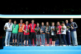 (L-R) Jacob Pebley, Jay Litherland, Jack Conger, Cody Miller, David Plummer, Hali Flickinger, Katie Baker, Katie Meili, Molly Hannis, Melanie Margalis, Elizabeth Beisel, Dana Vollmer and Sierra Ranger of the United States participate in the medal ceremony for the Olympic Team Qualifiers during Day Seven of the 2016 U.S. Olympic Team Swimming Trials at CenturyLink Center on July 2, 2016 in Omaha, Nebraska.  (Photo by Tom Pennington/Getty Images)
