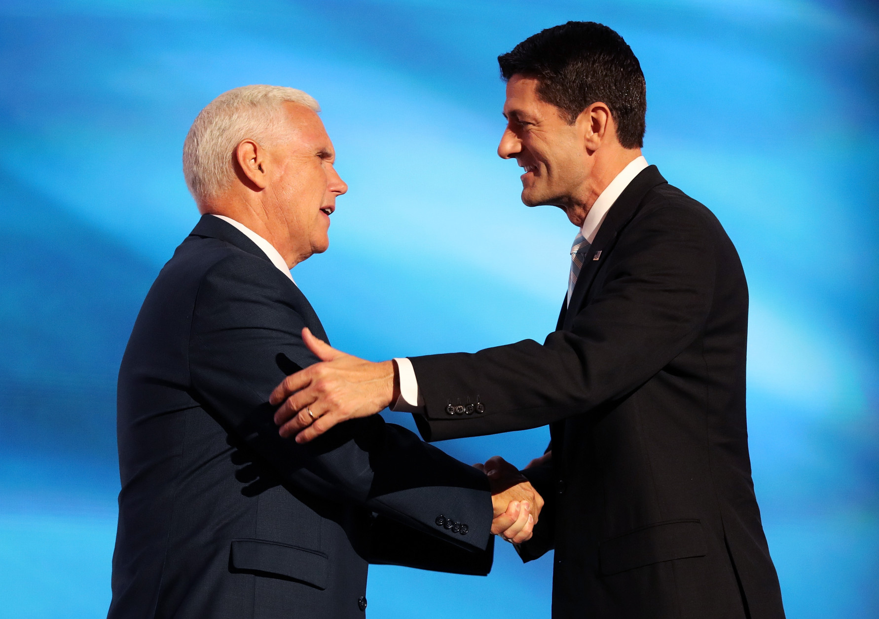 CLEVELAND, OH - JULY 20:  Speaker of the House Paul Ryan shakes the hand of Republican Vice Presidential candidate Mike Pence as he walks on stage to deliver a speech on the third day of the Republican National Convention on July 20, 2016 at the Quicken Loans Arena in Cleveland, Ohio. Republican presidential candidate Donald Trump received the number of votes needed to secure the party's nomination. An estimated 50,000 people are expected in Cleveland, including hundreds of protesters and members of the media. The four-day Republican National Convention kicked off on July 18.  (Photo by John Moore/Getty Images)