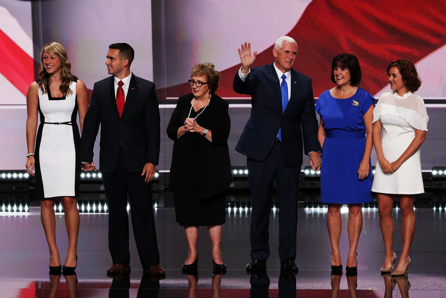 CLEVELAND, OH - JULY 20:  Republican vice presidential candidate Mike Pence (3rd-R) along with his mother Nancy Pence (3rd-R), daughter Audrey Pence (L), son Michael Pence (2nd-L), wife Karen Pence (2nd-R) and daughter Charlotte Pence (R) acknowledge the crowd on the third day of the Republican National Convention on July 20, 2016 at the Quicken Loans Arena in Cleveland, Ohio. Republican presidential candidate Donald Trump received the number of votes needed to secure the party's nomination. An estimated 50,000 people are expected in Cleveland, including hundreds of protesters and members of the media. The four-day Republican National Convention kicked off on July 18.  (Photo by Alex Wong/Getty Images)
