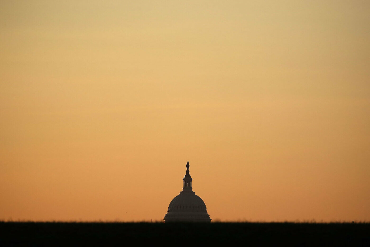 WASHINGTON, DC - JULY 21: The early morning sun begins to rise over the US Capitol, on July 21, 2016 in Washington, DC. Washington area temperatures are forecasted to reach the upper 90s for the next few days. (Photo by Mark Wilson/Getty Images)