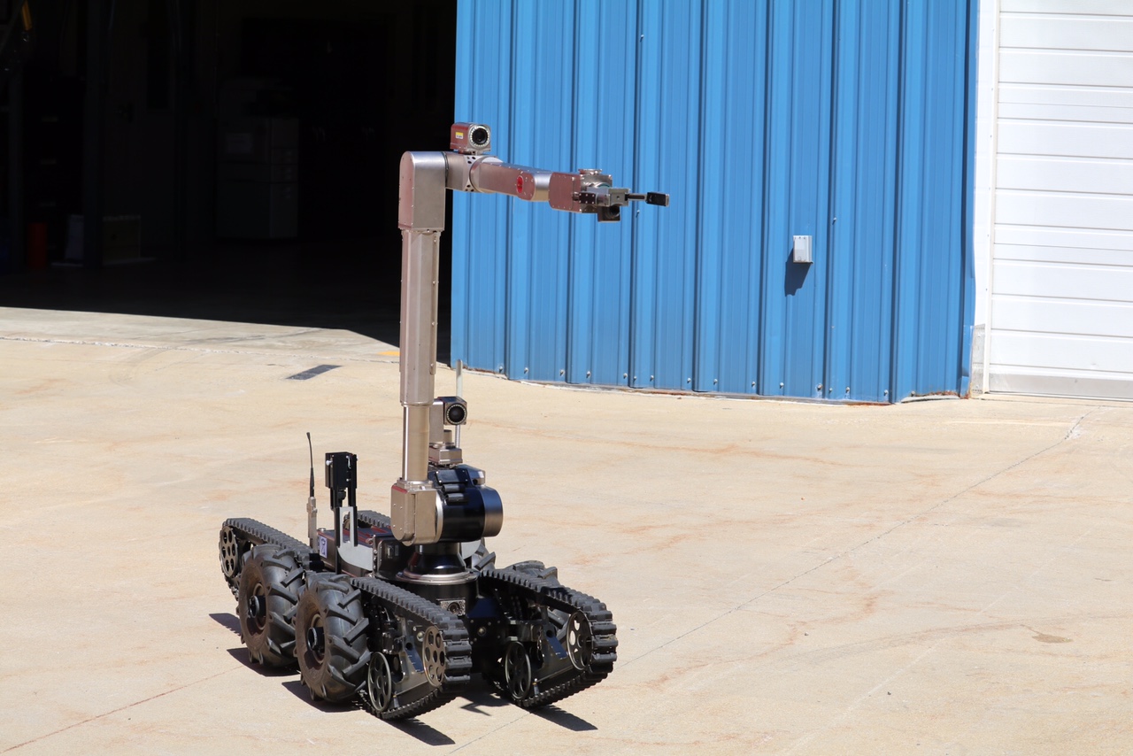 This mid-sized robot, one of several that Montgomery County Fire and Rescue's bomb squad uses, has an articulated hand so agile that it can pick up objects such as coins or test tubes. (WTOP/Kate Ryan)