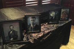 A picture of Ronald Reagan sat in front of the small coffin, next to portraits of Abraham Lincoln, Theodore Roosevelt and Dwight D. Eisenhower. (WTOP/Mike Murillo)