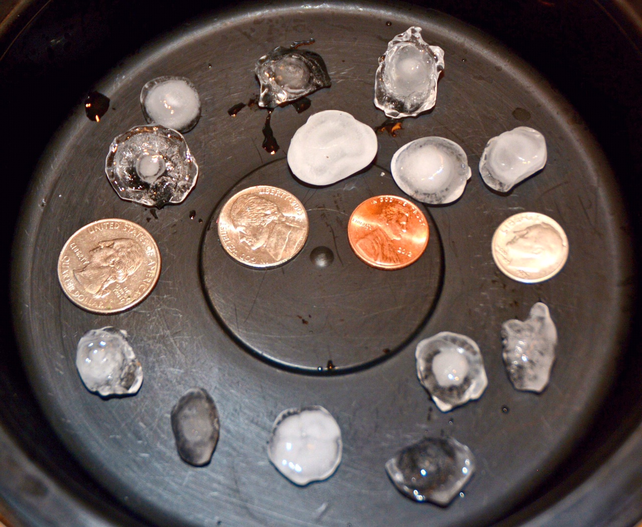 Hail up to the size of quarters in Friendship Heights. (WTOP/Dave Dildine)