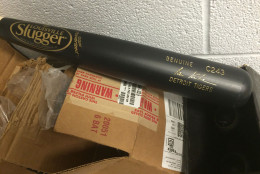 An Ian Kinsler bat is just one of many random pieces of equipment in Rose's office. (WTOP/Noah Frank)