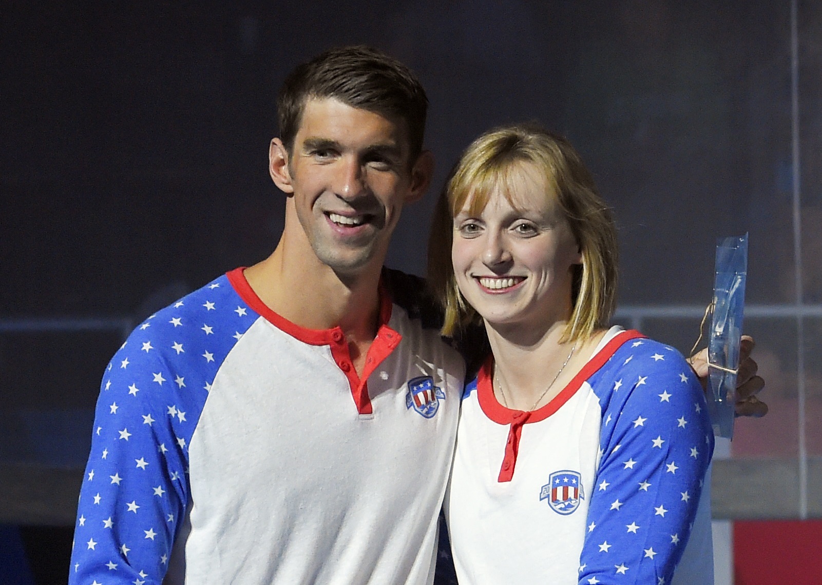 Michael Phelps stands with Katie Ledecky, right, during the team introductions at the conclusion of the U.S. Olympic swimming trials, Sunday, July 3, 2016, in Omaha, Neb. (AP Photo/Mark J. Terrill)