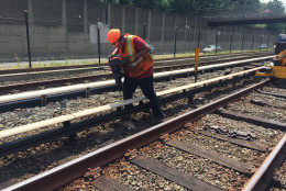A Metro worker is seen doing repairs during summer 2016's 24/7 trackwork program. (WTOP/Max Smith)