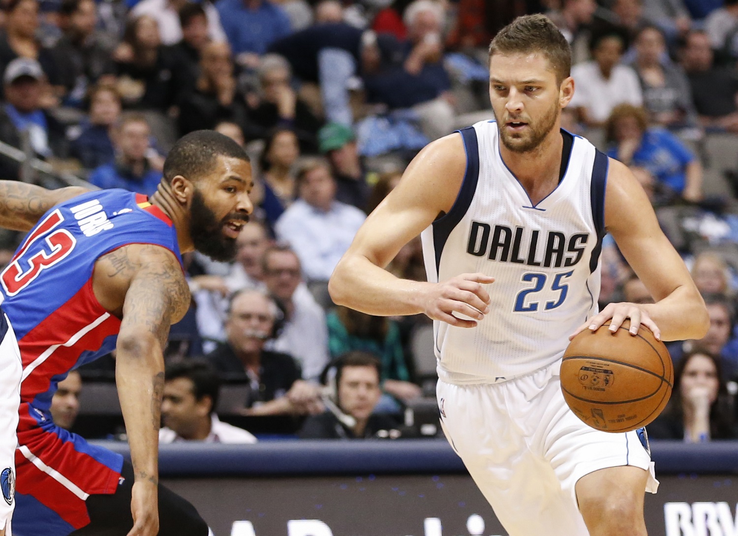 Dallas Mavericks forward Chandler Parsons (25) drives around Detroit Pistons forward Marcus Morris (13) during the first half of an NBA basketball game, Wednesday, March 9, 2016, in Dallas. (AP Photo/Jim Cowsert)