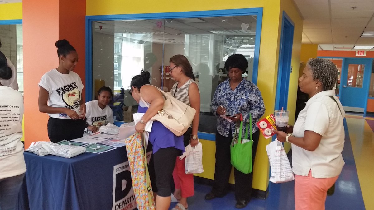 Residents pick up Zika prevention kits at Columbia Heights Community Center in D.C. on Saturday, July 16, 2016. (WTOP/Kathy Stewart)