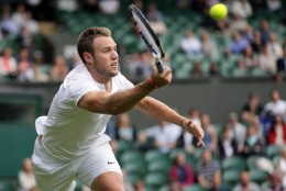 Jack Sock of the U.S returns to Milos Raonic of Canada during their men's singles match on day six of the Wimbledon Tennis Championships in London, Saturday, July 2, 2016. (AP Photo/Tim Ireland)