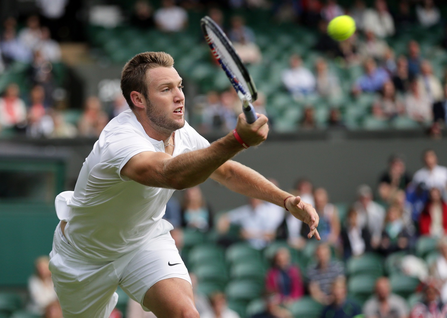 Jack Sock of the U.S returns to Milos Raonic of Canada during their men's singles match on day six of the Wimbledon Tennis Championships in London, Saturday, July 2, 2016. (AP Photo/Tim Ireland)