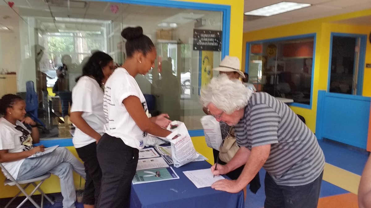 D.C. Health department staff hand out Zika virus prevention kits and teach residents about mosquito borne diseases on Saturday, July 16, 2016. (WTOP/Kathy Stewart)