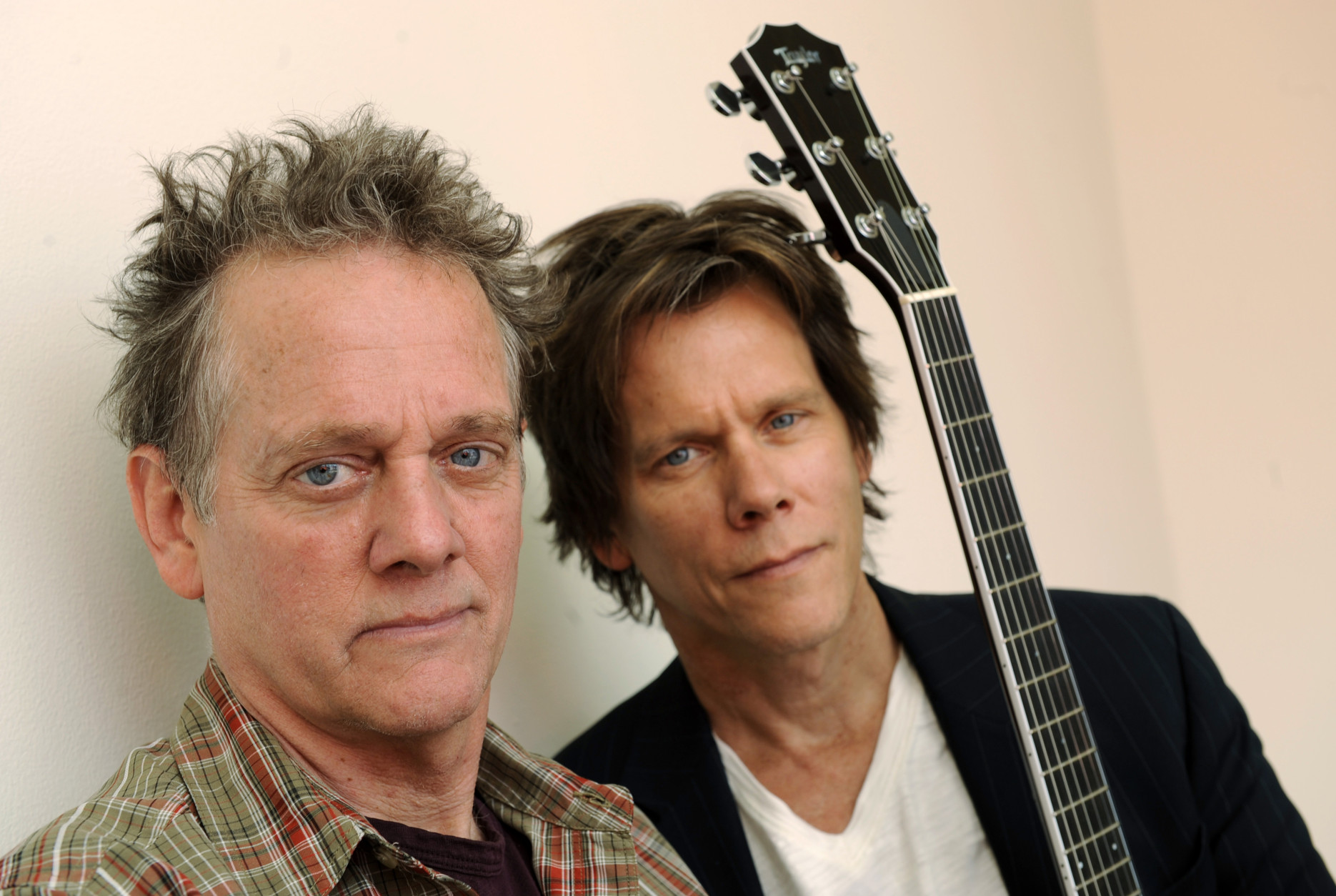 Michael Bacon, left, and Kevin Bacon of The Bacon Brothers band pose for a portrait in Los Angeles, Wednesday, March 25, 2009. (AP Photo/Chris Pizzello)