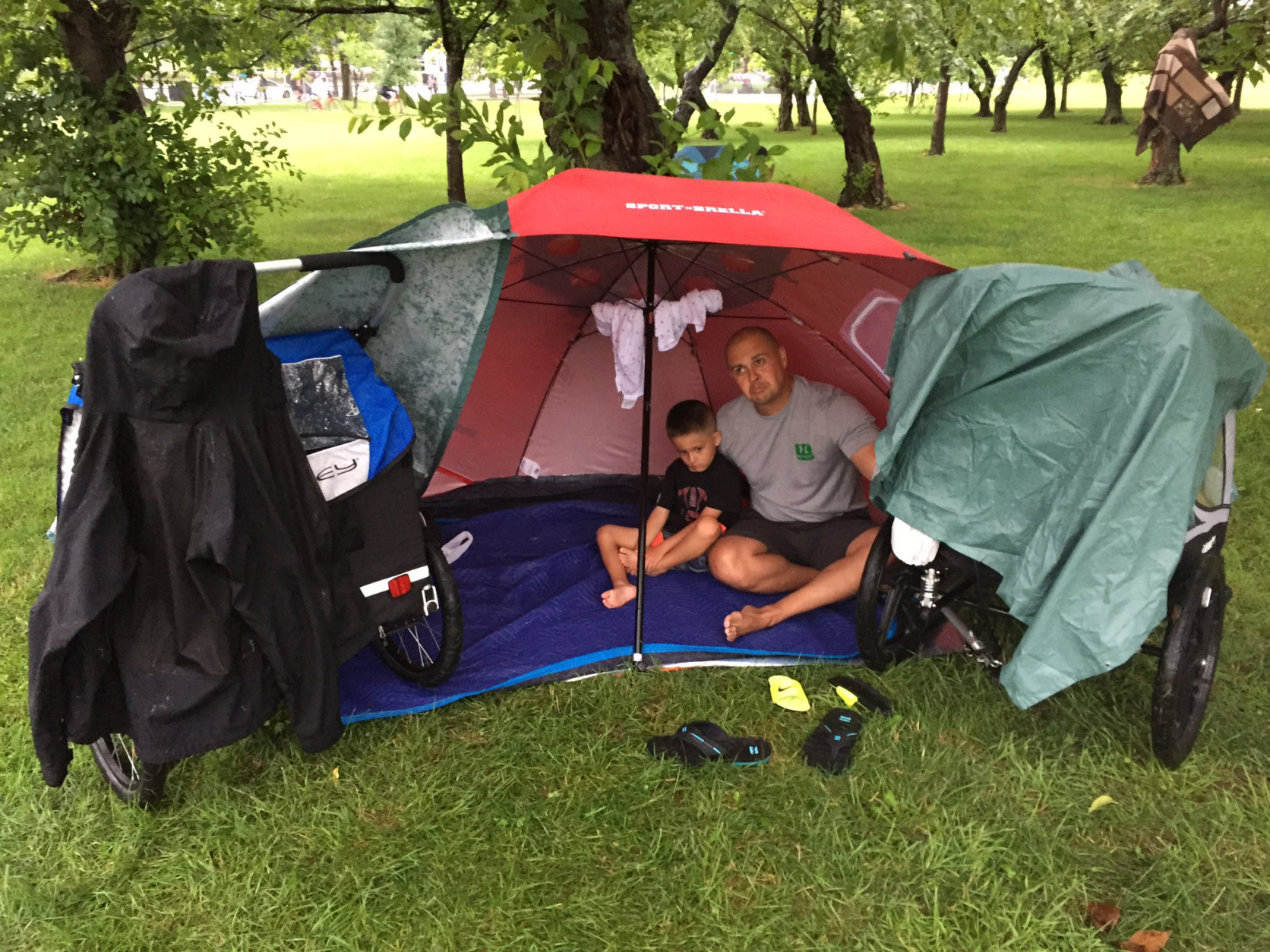 This family created a "base camp" to stay dry. They got to the National Mall at around 1 p.m. to prepare for the Fourth of July festivities. (WTOP/Michelle Basch)