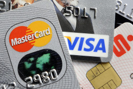 FILE - This Nov. 18, 2009, file photo, shows credit and bank cards with electronic chips in Gelsenkirchen, Germany. On Friday, July 8, 2016, the Federal Reserve releases its May report on consumer borrowing. (AP Photo/Martin Meissner, File)