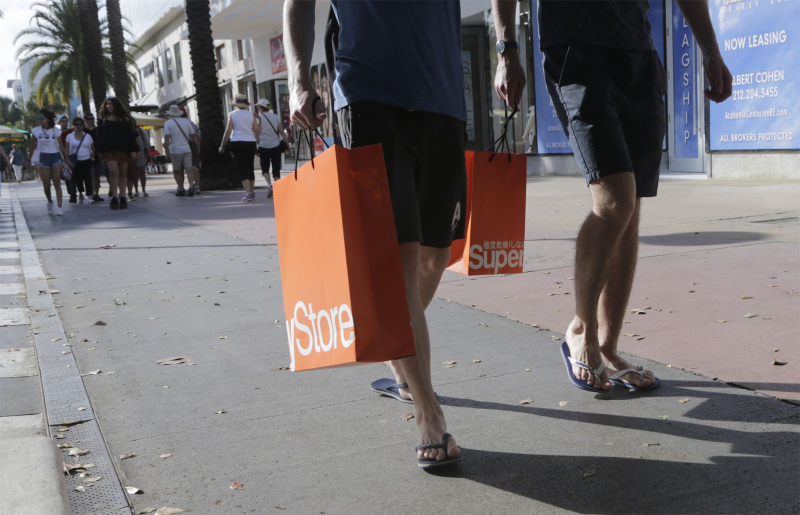 In this Wednesday, Feb. 3, 2016, photo, shoppers walk along Lincoln Road Mall, a pedestrian area featuring retail shops and restaurants in Miami Beach, Fla. On Friday, Feb. 19, 2016, the Labor Department reports on consumer prices for January. (AP Photo/Lynne Sladky)